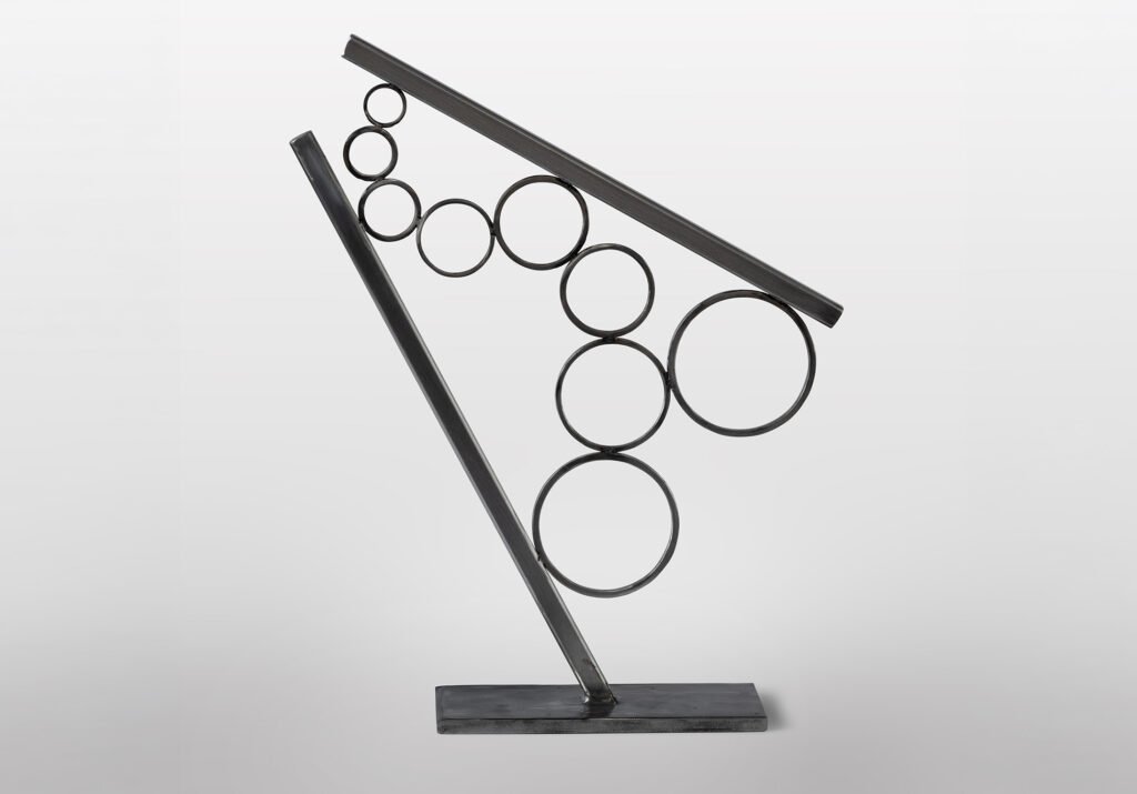 Mutual Gravity by Rachel Gardner, metal sculpture with suspended circular forms within an angular frame