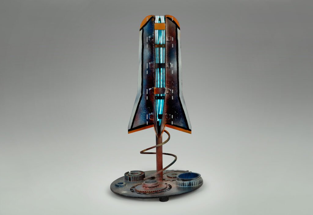 Out of Space by Steven Varga, illuminated mixed-media sculpture with a rocket-like form, gears, and spiral metalwork